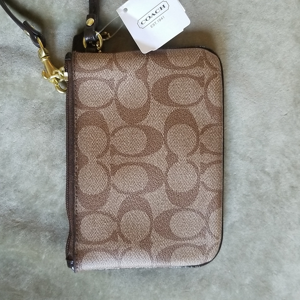 Coach mini wristlet.